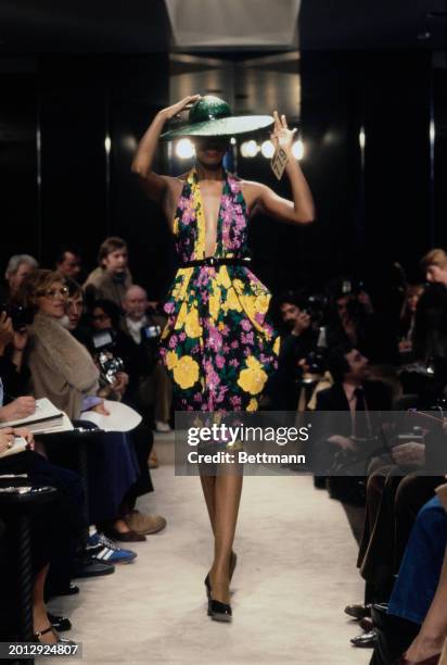 Model wearing a floral print halter-neck dress from Chanel's collection for spring and summer, Paris, January 30th 1979.