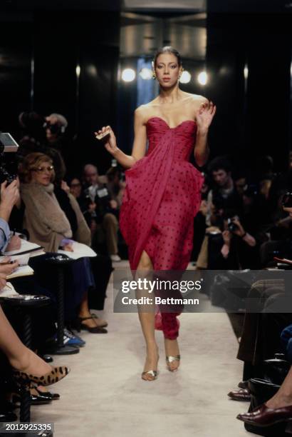 Model wearing a cerise polka dot print dress from Chanel's collection for spring and summer, Paris, January 30th 1979.