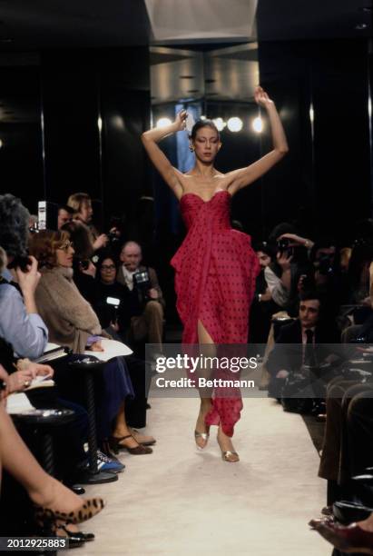 Model wearing a cerise polka dot print dress from Chanel's collection for spring and summer, Paris, January 30th 1979.