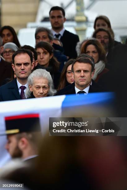 The coffin of Robert Badinter passes mourners and the widow of late French Justice Minister Robert Badinter, French philosopher Elisabeth Badinter...