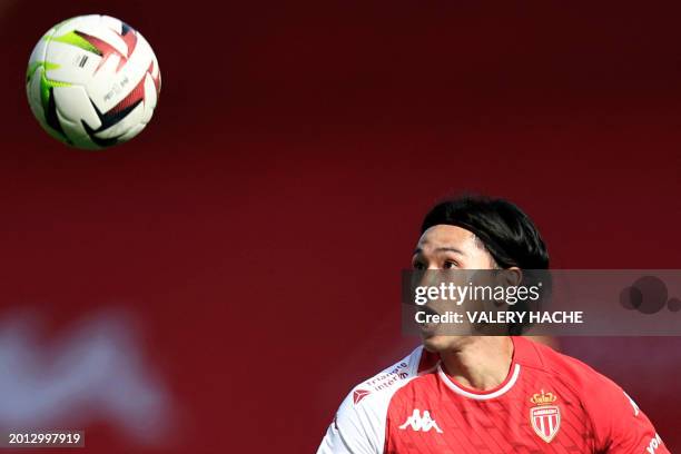 Monaco's Japanese forward Takumi Minamino eyes the ball during the French L1 football match between AS Monaco and Toulouse FC at the Louis II stadium...