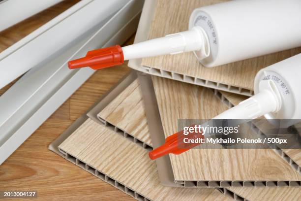 high angle view of work tools on table - linoleum table stock pictures, royalty-free photos & images