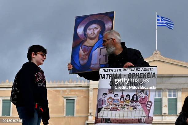 Greek-Orthodox people participate in a protest against the legislation of same sex-marriages and adoption by same-sex couples, on February 15, 2024...