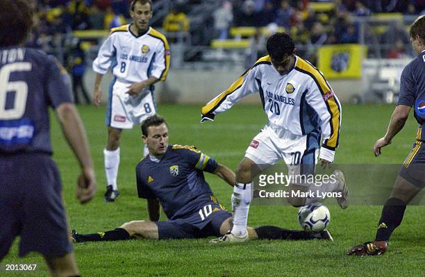 Carlos Ruiz of the Los Angeles Galaxy battles for the ball against Brian Maisonneuve of the Columbus Crew on October 24, 2002 during the Lamar Hunt...