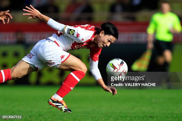 Monaco's Japanese forward Takumi Minamino eyes the ball during the French L1 football match between AS Monaco and Toulouse FC at the Louis II Stadium...