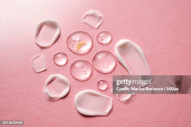 directly above shot of pills on pink table - ointment stock pictures, royalty-free photos & images
