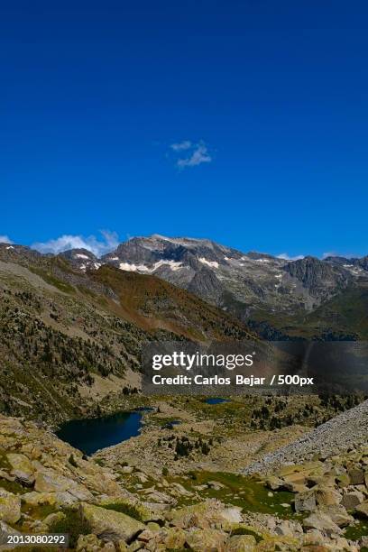 scenic view of landscape against clear blue sky - viajes stock pictures, royalty-free photos & images