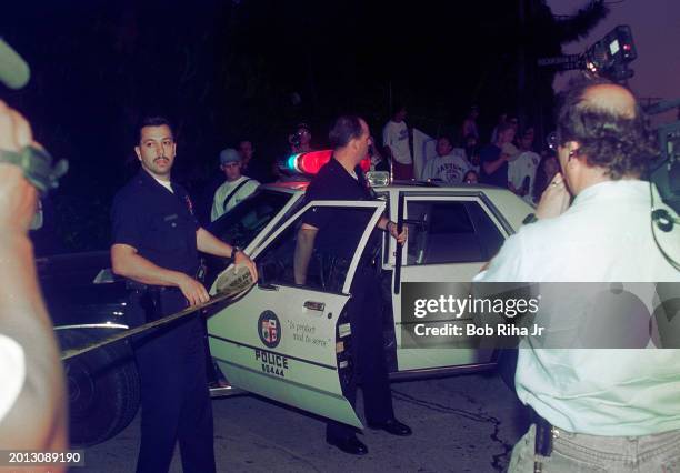 Los Angeles Police Department officers arrive and do crowd control at Rockingham Avenue and Sunset Boulevard following OJ Simpson freeway police...