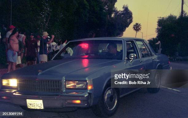Los Angeles Police Department officers arrive and do crowd control at Rockingham Avenue and Sunset Boulevard following OJ Simpson freeway police...
