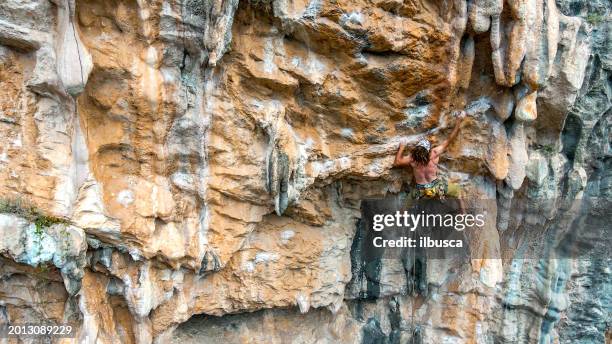 climber in finale ligure cliffs, italy - rock climbing stock pictures, royalty-free photos & images