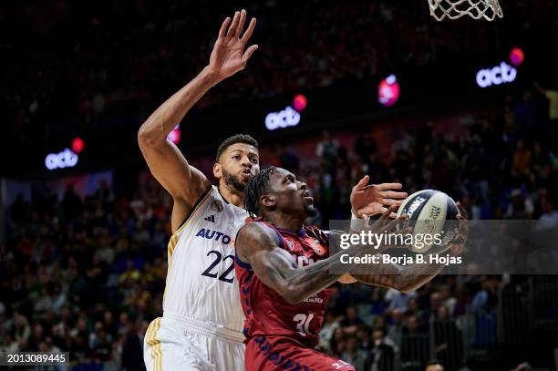 Edy Tavares of Real Madrid and Dylan Ennis of UCAM Murcia in action during Quarter Finals of Copa del Rey 2024 at Martin Carpena Arena on February...