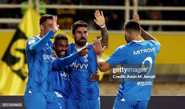 Malcom of Al Hilal celebrates with teammates after scoring his team's first goal during the AFC Champions League Playoff 1st Leg match between...