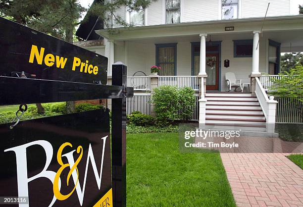 New Price" sign is visible on a Baird & Warner sign in front of a single-family existing home for sale in a neighborhood May 19, 2003 in Park Ridge,...