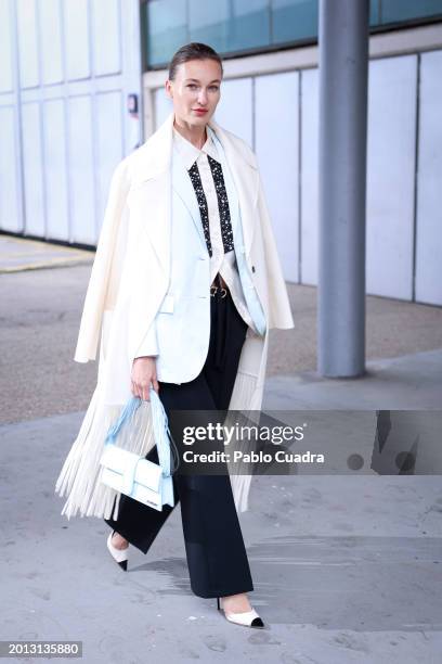 Lana Tavalynska wears Elisabetta Franchi shoes, Jacquemus handbag, Ermanno Firenze, jacket and Zara clothes during the Mercedes Benz Fashion Week...