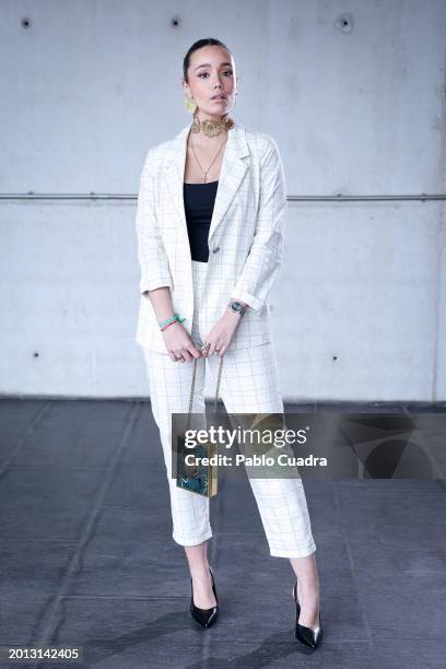 Maria Fortes wears Alma En Pena shoes, Momoni suit and Kurt Geiger handbag during the Mercedes Benz Fashion Week Madrid at IFEMA on February 15, 2024...