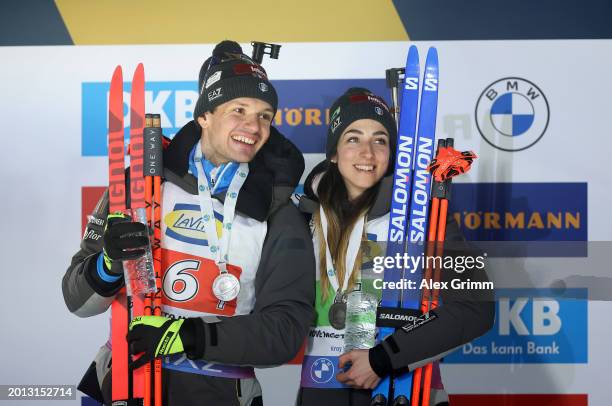 Second placed Lisa Vittozzi and Tommaso Giacomel of Italy celebrate on the podium following the Single Mixed Relay at the IBU World Championships...