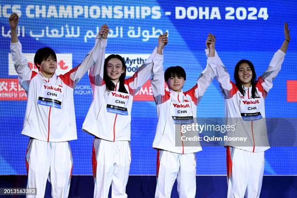 Gold Medalists, Yanhan Ai, Zhenqi Gong, Bingjie Li and Peiqi Yang of Team People's Republic of China celebrate on the podium during the Medal...