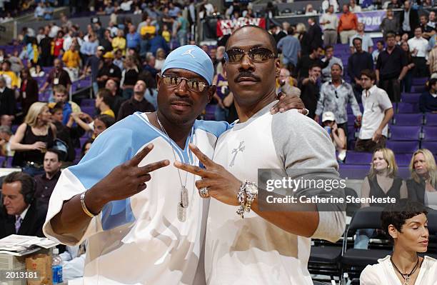 Actor Martin Lawrence and Eddie Murphy pose for a picture prior to Game six between the San Antonio Spurs and the Los Angeles Lakers of the Western...