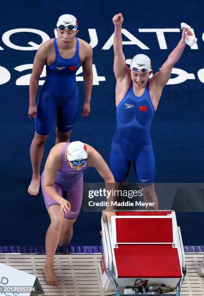 Yanhan Ai, Zhenqi Gong and Bingjie Li of Team People's Republic of China react as teammate Peiqi Yang competes in the Women's 4x200m Freestyle Final...