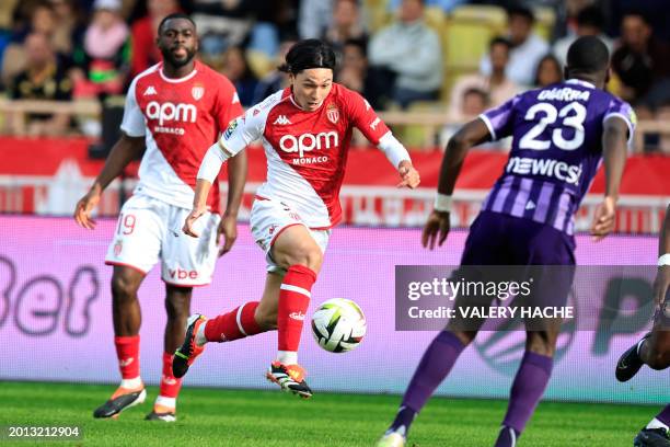Monaco's Japanese forward Takumi Minamino runs with the ball during the French L1 football match between AS Monaco and Toulouse FC at the Louis II...