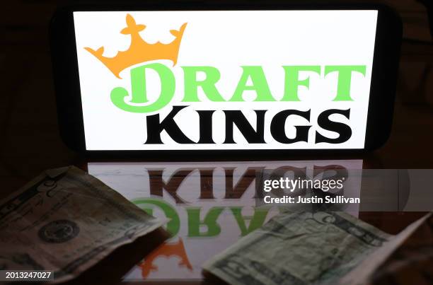 In this photo illustration, the DraftKings logo is displayed on a phone screen on February 15, 2024 in San Anselmo, California. Fantasy sports and...