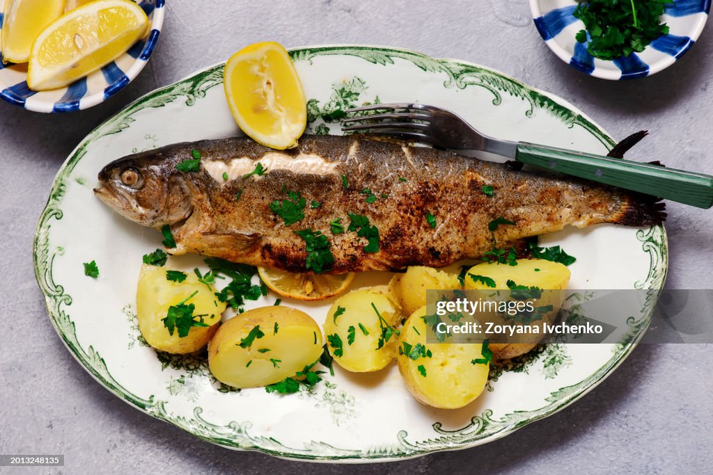 Fried rainbow trout with boiled potatoes