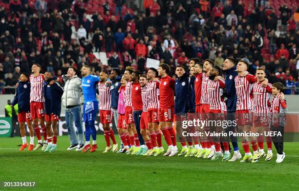 Players of Olympiakos celebrate in front of their fans after defeating Ferencvarosi TC during the UEFA Europa Conference League 2023/24 Knockout...