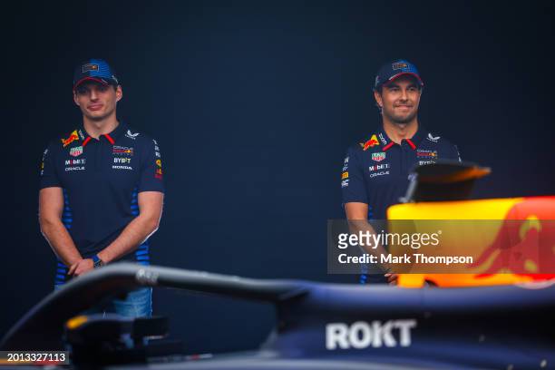 Max Verstappen of the Netherlands and Oracle Red Bull Racing and Sergio Perez of Mexico and Oracle Red Bull Racing stand with the RB20 during the...