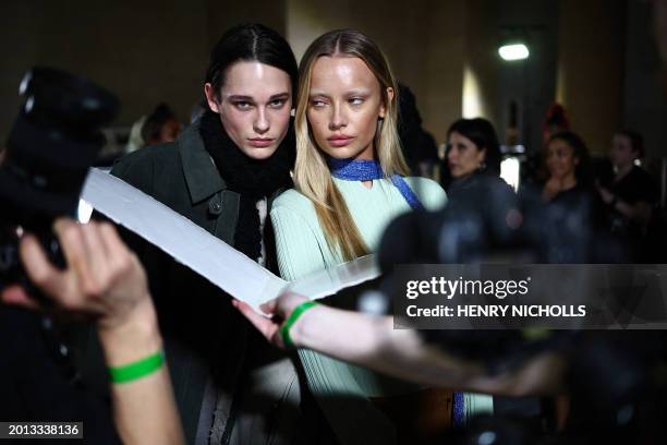 Models pose for a photograph back-stage ahead of the catwalk presentation for Norwegian fashion house Holzweiler for their Autumn/Winter 2024...