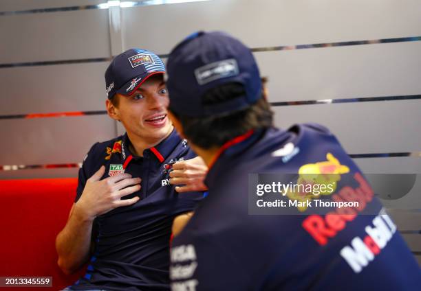 Max Verstappen of the Netherlands and Oracle Red Bull Racing talks with Sergio Perez of Mexico and Oracle Red Bull Racing during the Oracle Red Bull...