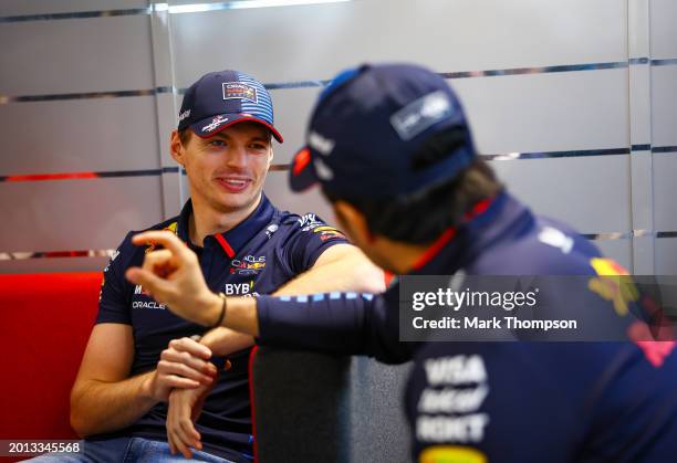 Max Verstappen of the Netherlands and Oracle Red Bull Racing talks with Sergio Perez of Mexico and Oracle Red Bull Racing during the Oracle Red Bull...