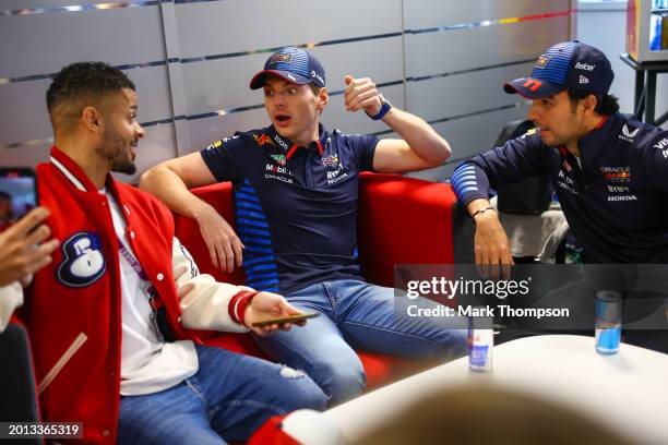 Max Verstappen of the Netherlands and Oracle Red Bull Racing and Sergio Perez of Mexico and Oracle Red Bull Racing talk with Jeremy Lynch, during the...