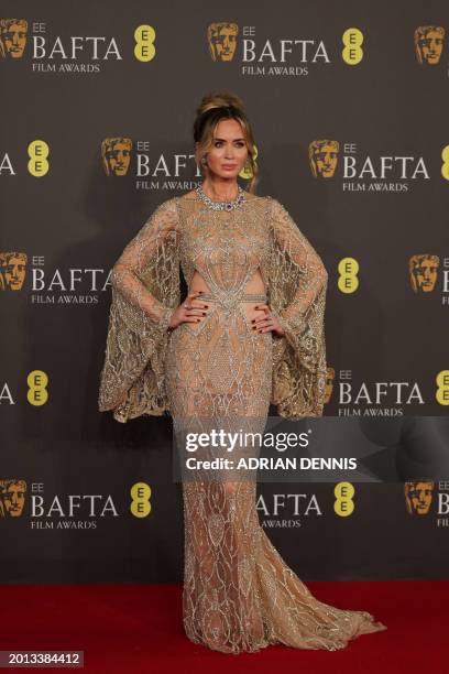 British and US actress Emily Blunt poses on the red carpet upon arrival at the BAFTA British Academy Film Awards at the Royal Festival Hall,...