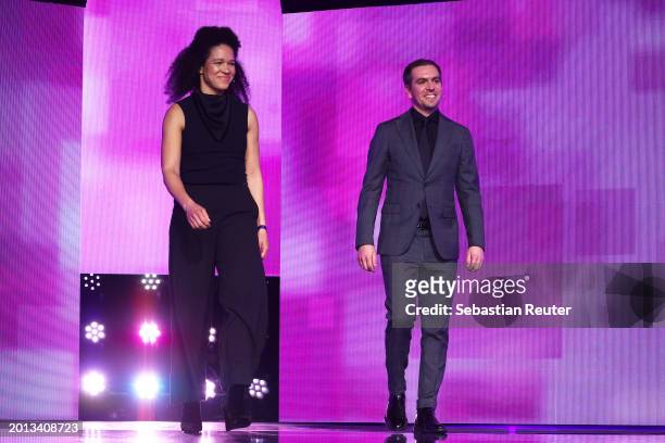 Célia Šašić and Philipp Lahm arrive onstage at the Opening Ceremony for the 74th Berlinale International Film Festival Berlin at Berlinale Palast on...
