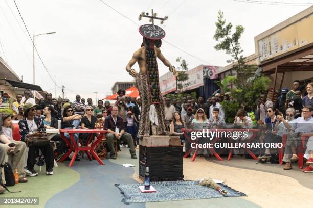 Performer and dancer Zora Snake performs as part of his show "L'opera du Villageois", during the first edition of the Kigali Triennial in Kigali on...