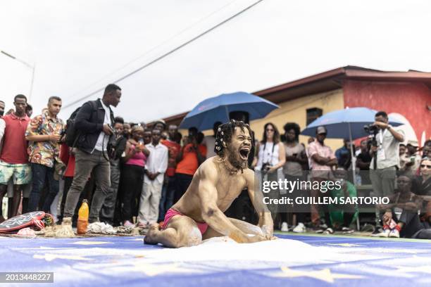 Performer and dancer Zora Snake performs as part of his show "L'opera du Villageois", during the first edition of the Kigali Triennial in Kigali on...