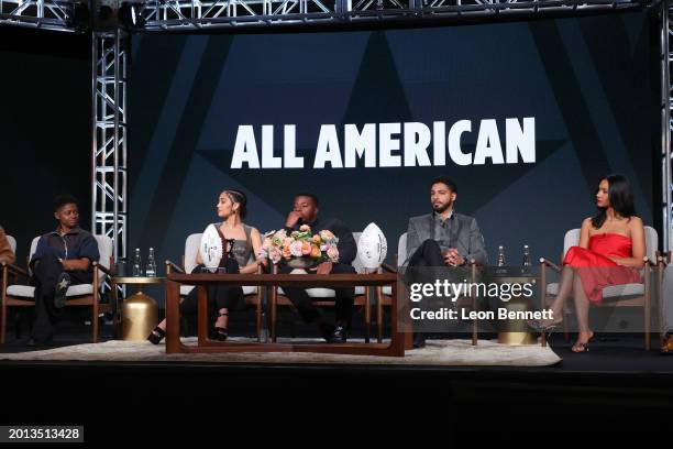 Bre-Z, Samantha Logan, Daniel Ezra, Michael Evans Behling and Grata Onieogou speak onstage at The CW presentation of "All American" during the 2024...