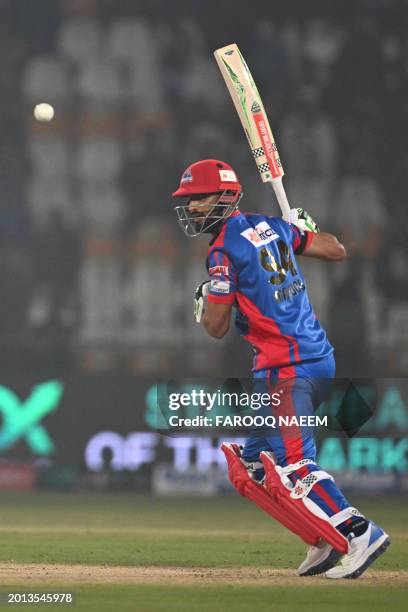 Karachi King's Shan Masood plays a shot during the Pakistan Super League Twenty20 cricket match between Multan Sultans and Karachi Kings at the...