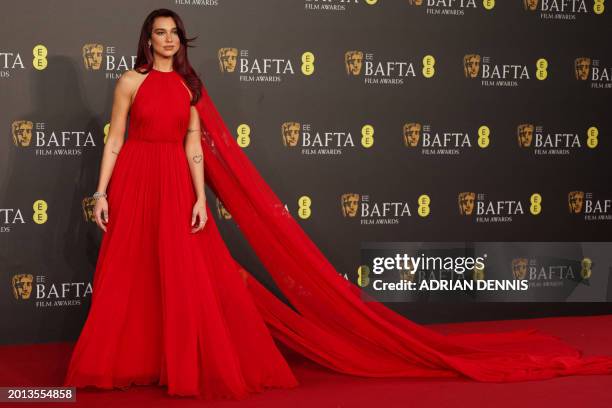 British actor Dua Lipa poses on the red carpet upon arrival at the BAFTA British Academy Film Awards at the Royal Festival Hall, Southbank Centre, in...