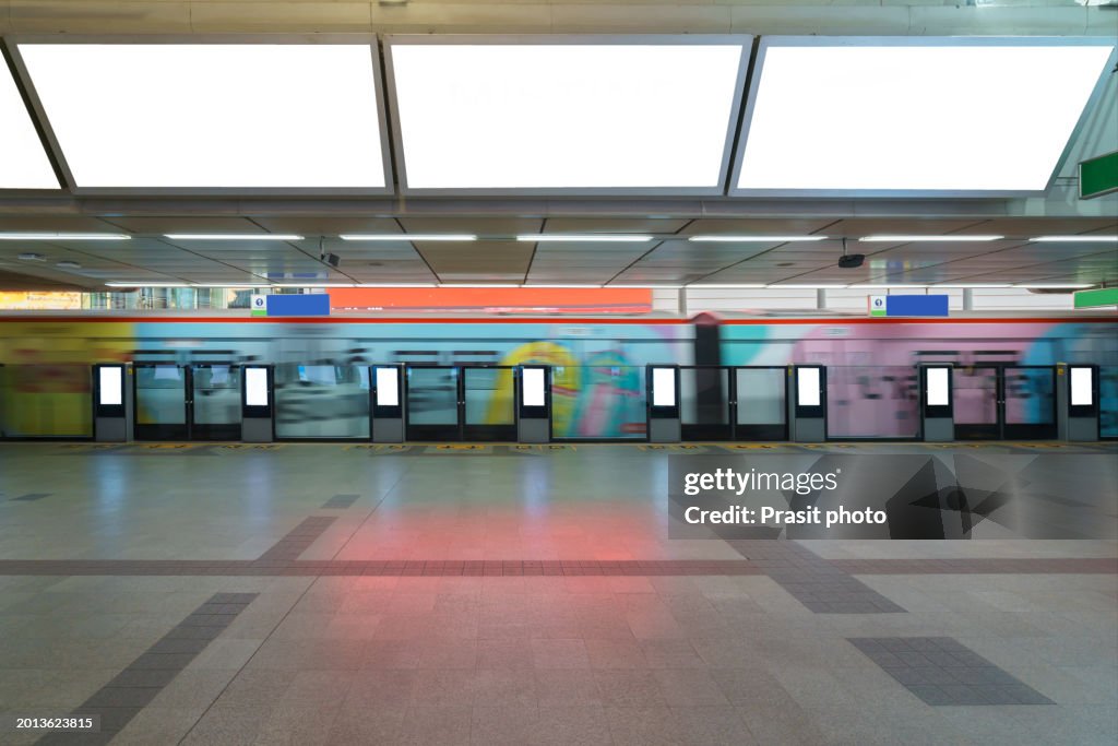 White billboard mock up is located on subway or train station to advertise