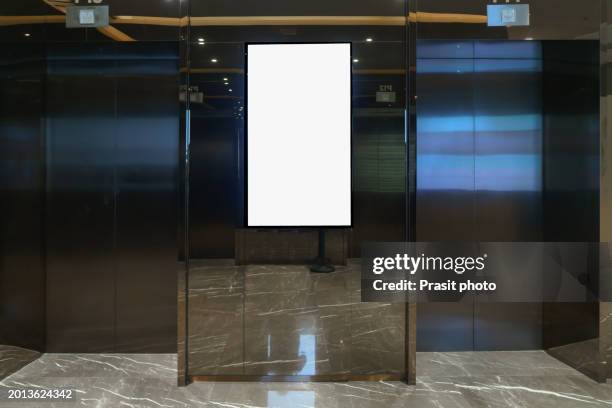 mock up blank banners display in font of lift at modern building interior - elevator mall stock pictures, royalty-free photos & images