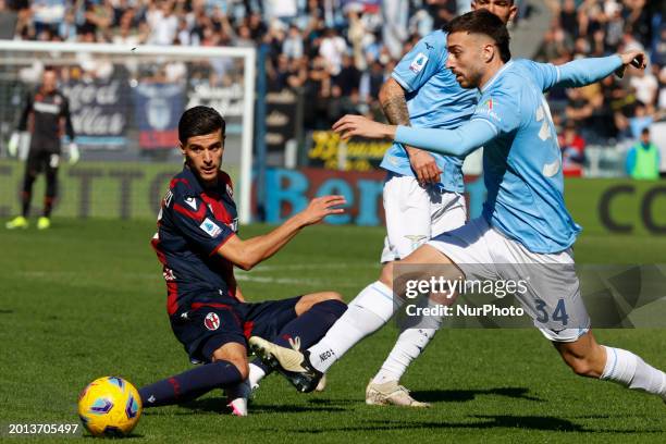 Oussama El Azzouzi of Bologna and Fuentes Mario Gila of Lazio are in action during the Serie A soccer match between SS Lazio and Bologna FC at Stadio...