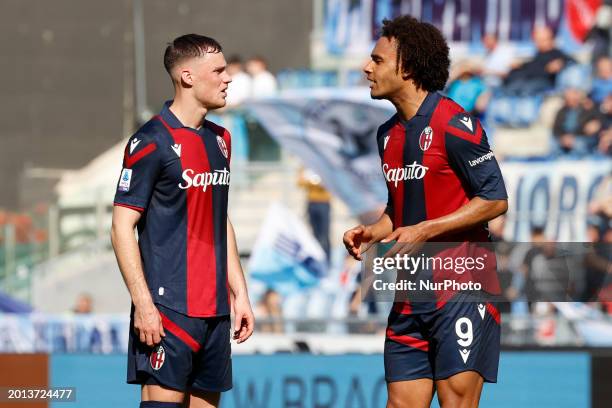 Joshua Zirkzee of Bologna is talking with Stefan Posch of Bologna during the Serie A soccer match between SS Lazio and Bologna FC at Stadio Olimpico...