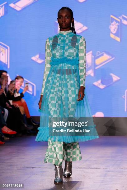 Model walks the runway during the Fashion Scout show during London Fashion Week February 2024 at Protein Studios on February 18, 2024 in London,...