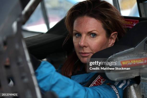 Jennifer Jo Cobb, driver of the Chevrolet, looks on in her truck during practice for the NASCAR Craftsman Truck Series Fresh from Florida 250 at...