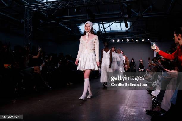 Models walks the runway during the Fashion Scout show during London Fashion Week February 2024 at Protein Studios on February 18, 2024 in London,...