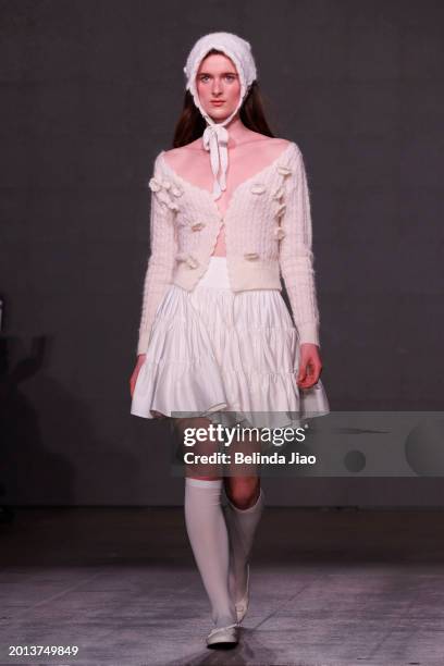 Model walks the runway during the Fashion Scout show during London Fashion Week February 2024 at Protein Studios on February 18, 2024 in London,...