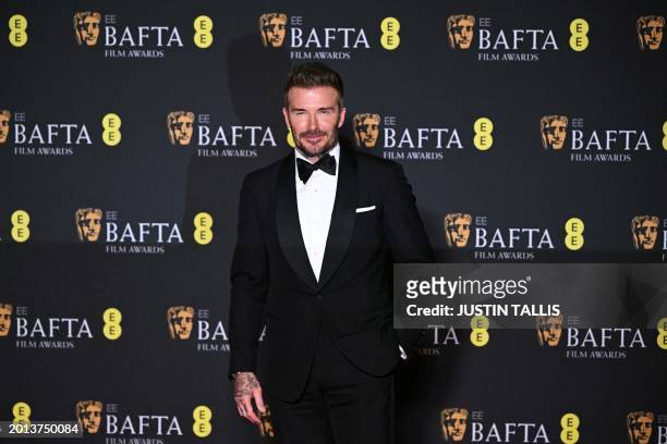 English former football player David Beckham poses in the Winners Room during the BAFTA British Academy Film Awards at the Royal Festival Hall,...