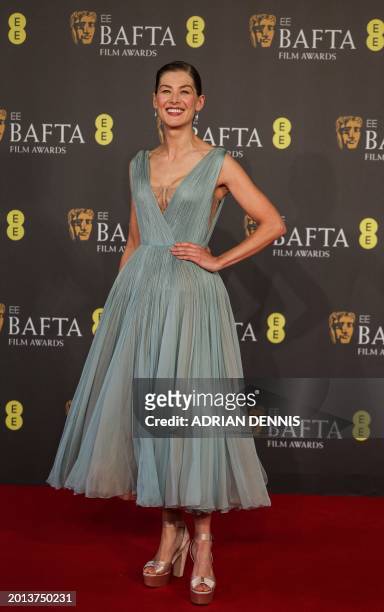 British actress Rosamund Pike poses on the red carpet upon arrival at the BAFTA British Academy Film Awards at the Royal Festival Hall, Southbank...
