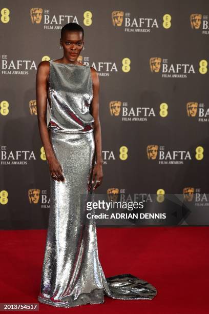 British Ugandan actress Sheila Atim poses on the red carpet upon arrival at the BAFTA British Academy Film Awards at the Royal Festival Hall,...